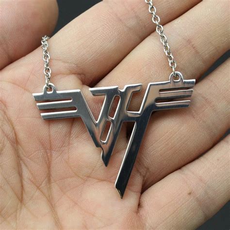 The artwork features EVH playing his infamous Frankenstrat and wearing a Van Halen necklace. . Van halen necklace